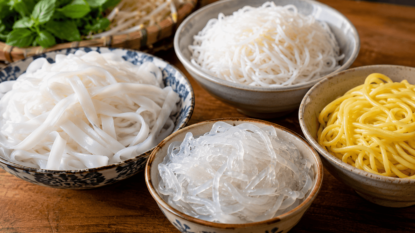 A spread of Vietnamese noodle soups including pho, bun bo Hue, and hu tieu